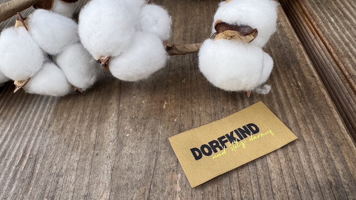 Label "DORFKIND - und stolz darauf"