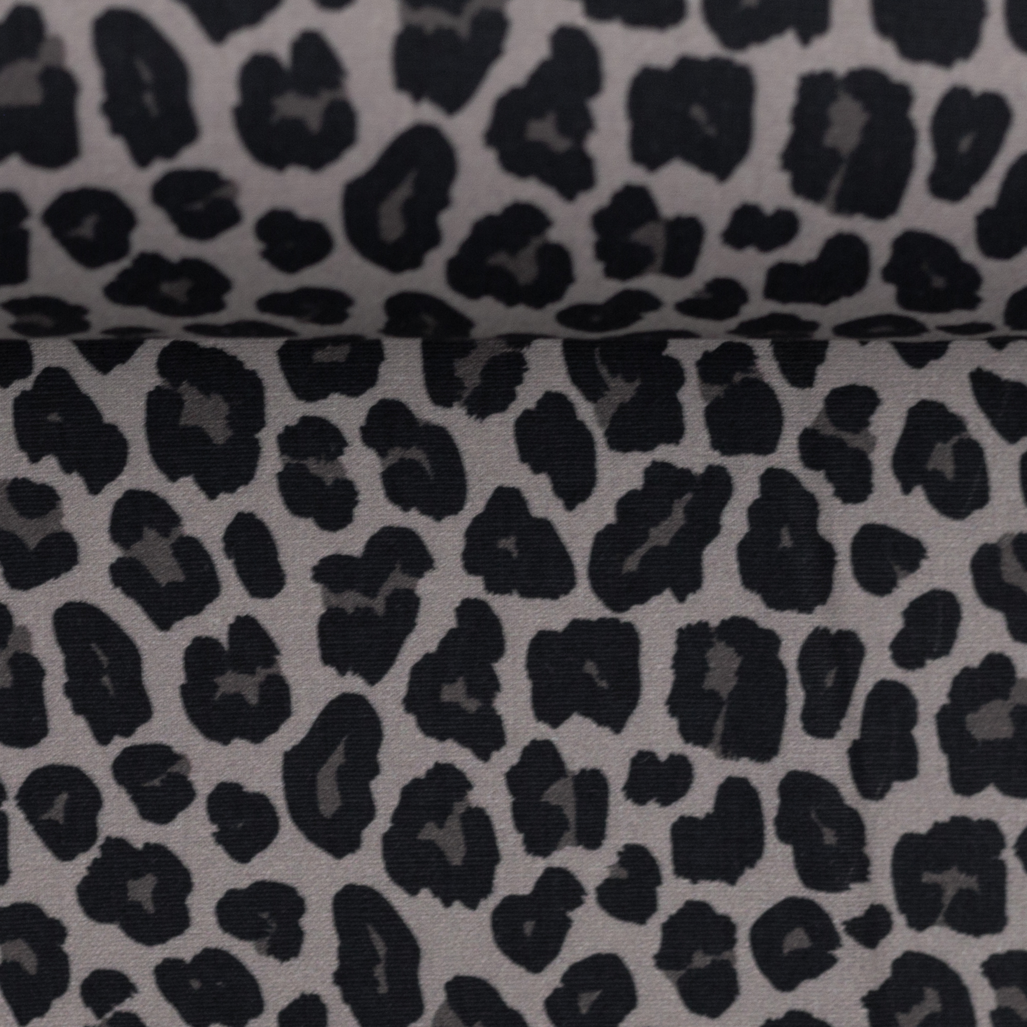 Baumwollstoff Leoparden-Print schwarz auf grauem Grund